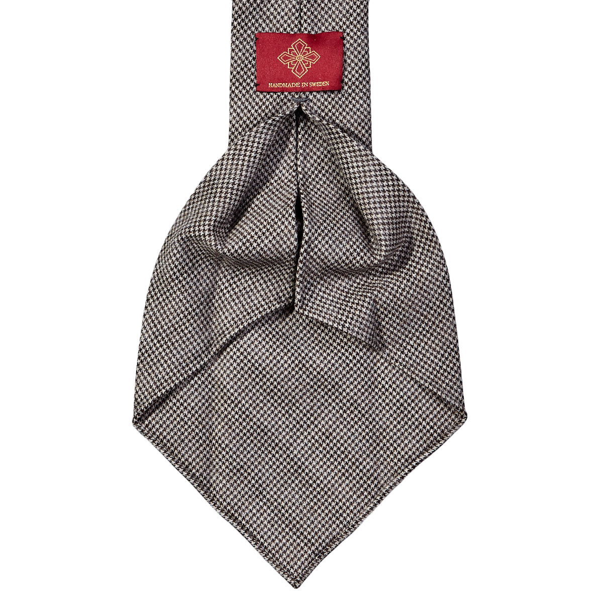 A handmade Dreaming Of Monday Brown Houndstooth 7-Fold Vintage Wool Tie on a white background.
