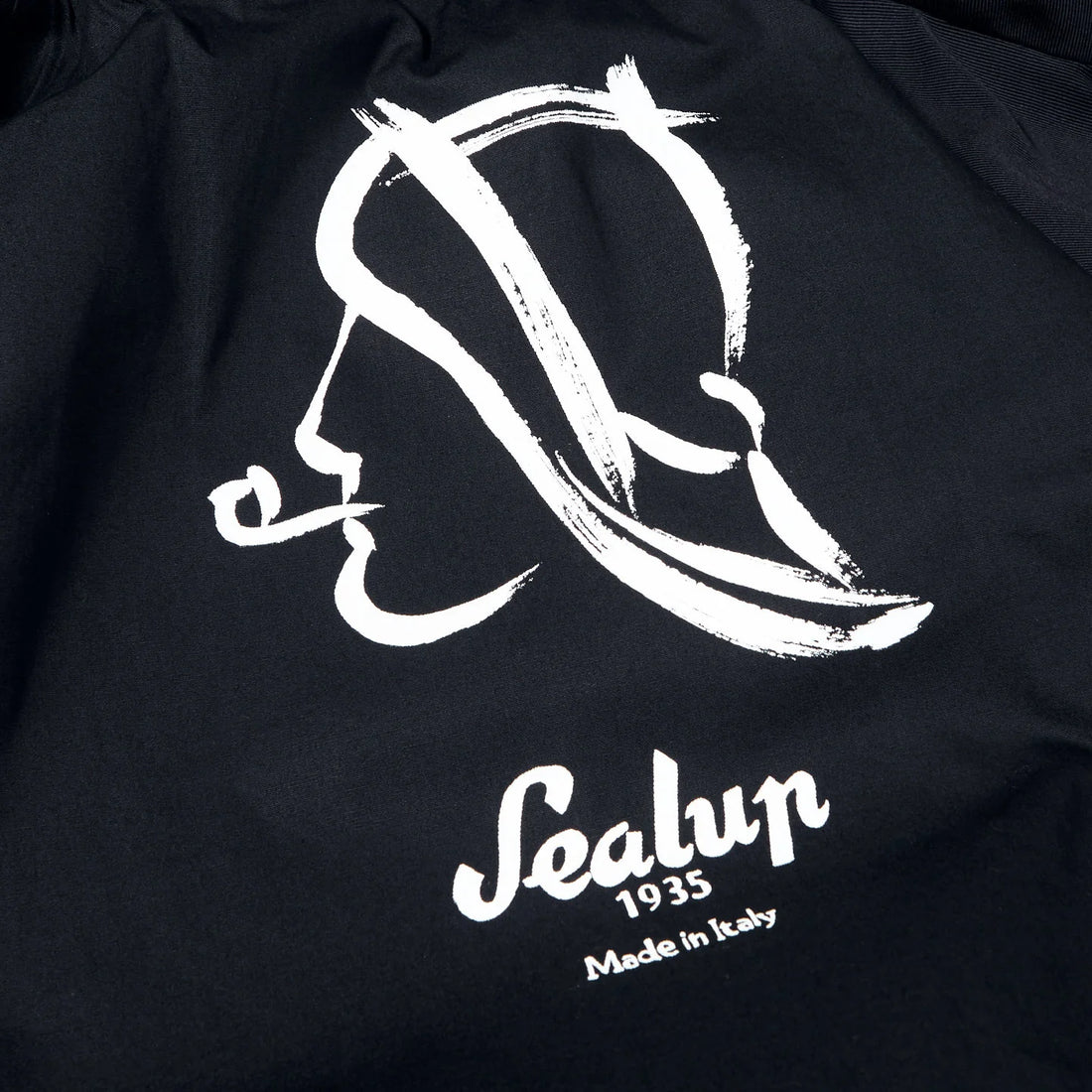 Black fabric featuring a white stylized logo of a face in profile with the text "sealup 1935 made in italy" below.