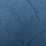 Close-up of a Alan Paine Airforce Blue Luxury Cotton V-Neck Sweater with ribbed cuff detail.