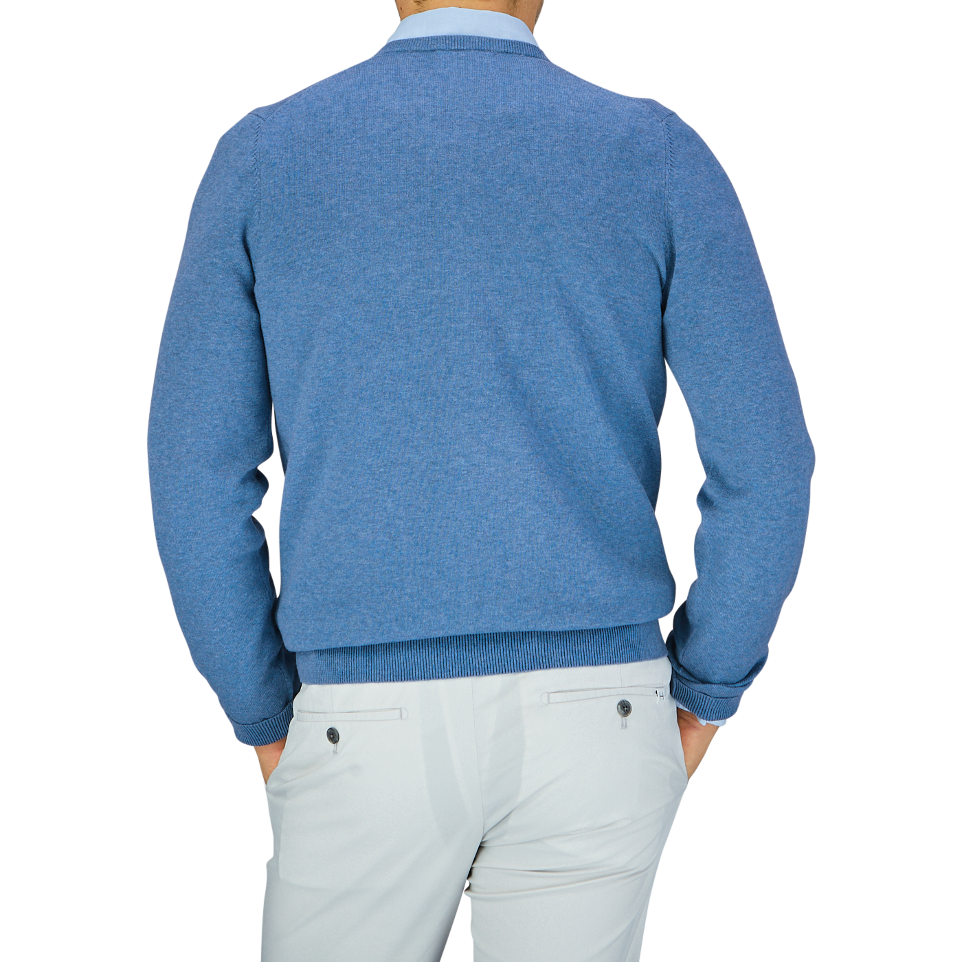 A person from behind wearing an Alan Paine Airforce Blue Luxury Cotton V-Neck Sweater and white pants.