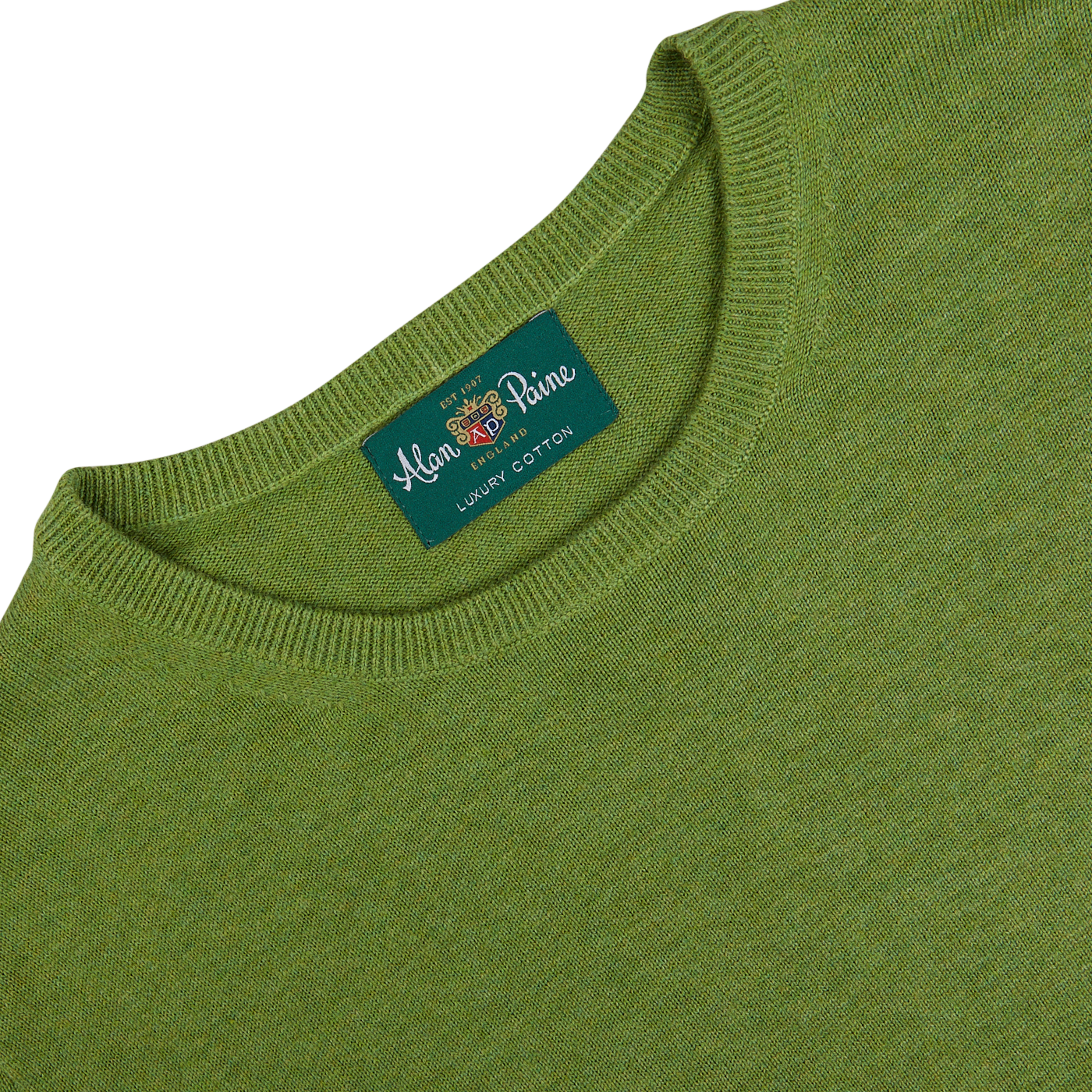 Avocado Green Luxury Cotton Crewneck sweater with a label showing the brand "Alan Paine - London estd 1975.