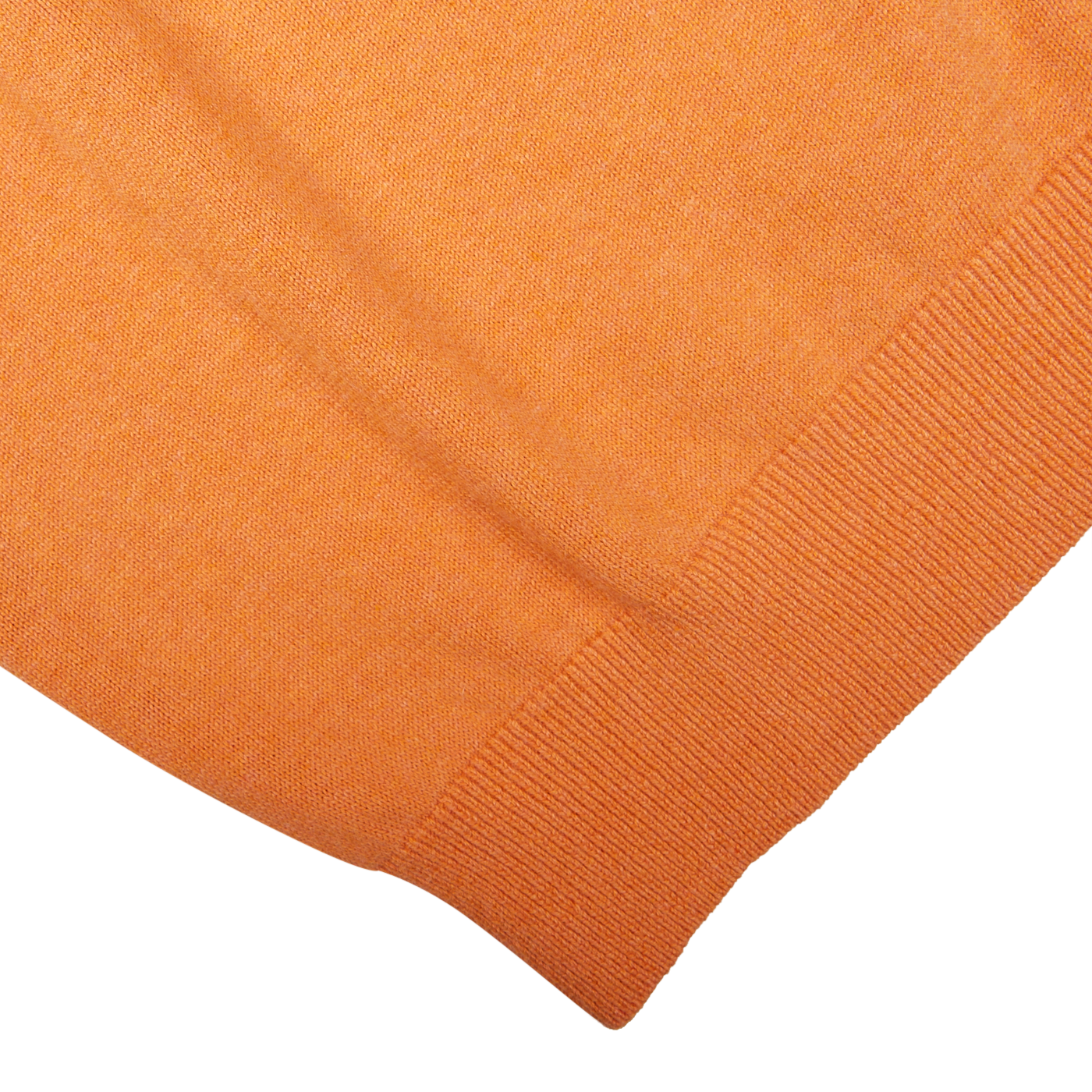 Close-up of a Blazing Orange Luxury Cotton Crewneck mixed with cashmere fabric with visible texture and hemming by Alan Paine.