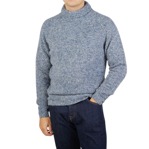 A man wearing an Alan Paine regular fit Spreckle Wool Alpaca Tweed Roll Neck sweater.