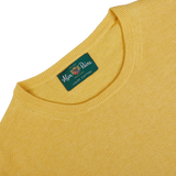 Corn Yellow Luxury Cotton Crewneck sweater with a clothing label that reads "Alan Paine, luxury cotton cashmere.