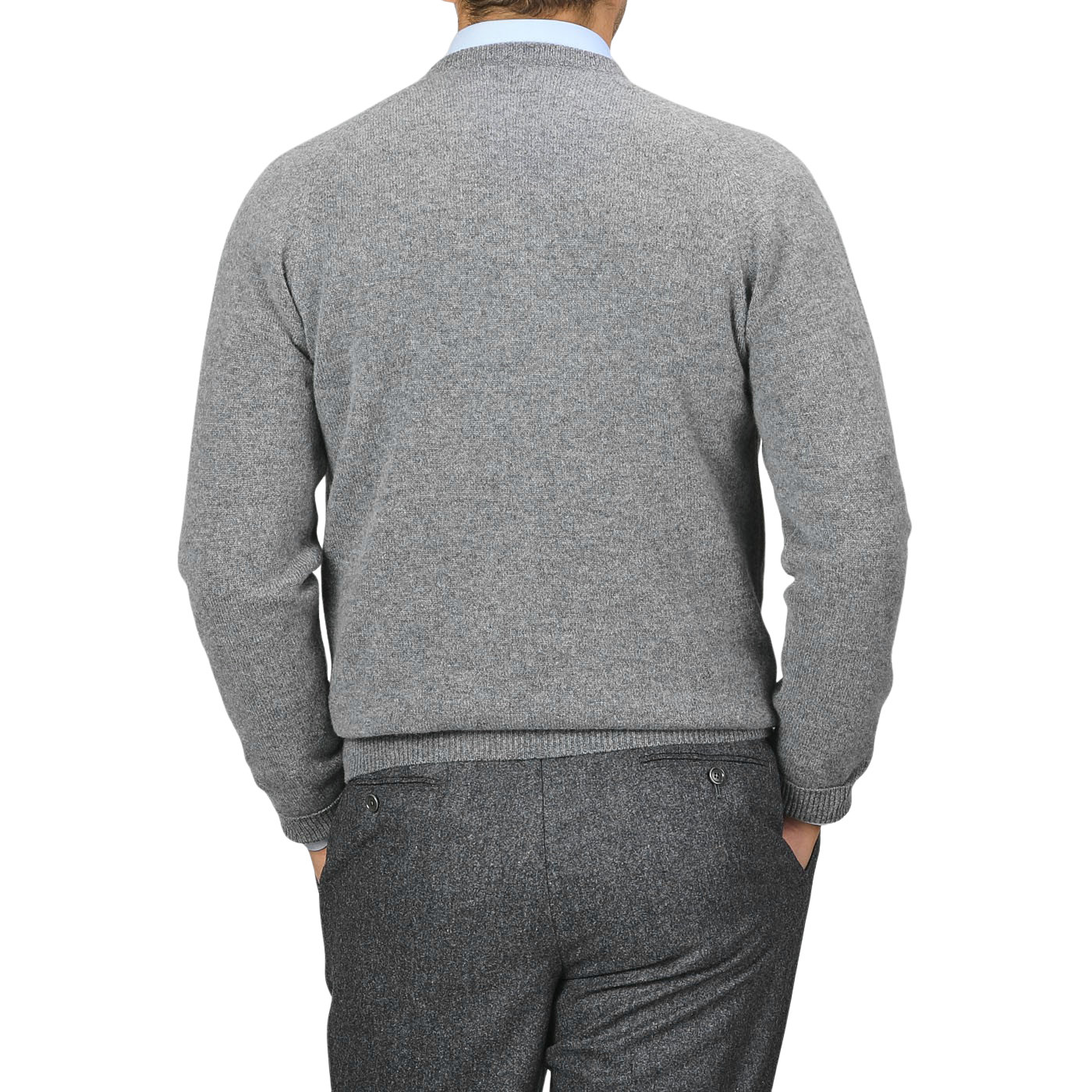 A man wearing the Grey Melange Lambswool Crew Neck by Alan Paine and grey trousers is photographed from the back against a plain background.