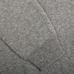 Close-up view of a Grey Melange Lambswool V-Neck sweater sleeve by Alan Paine with ribbed cuffs.