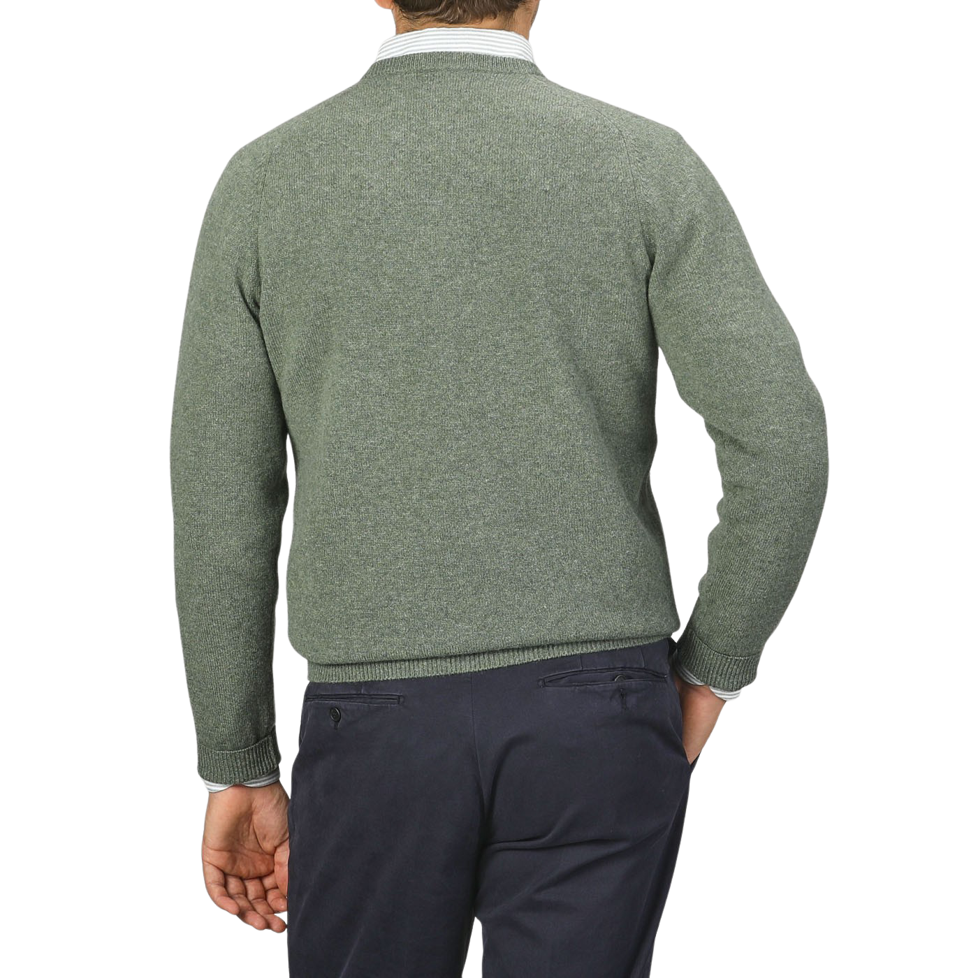 A person is seen from the back, wearing an Alan Paine Landscape Green Lambswool Crew Neck and dark-colored pants, with their right hand in their pocket.