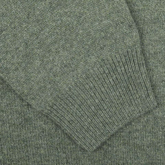 Close-up image of the sleeve of the Alan Paine Landscape Green Lambswool Crew Neck, showcasing its detailed stitching and ribbed cuff, crafted from soft Australian lambswool for a contemporary fit.