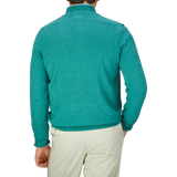 The back view of a man wearing a Moorland Green Luxury Cotton 1/4 Zip Sweater by Alan Paine.
