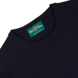 Navy blue Alan Paine luxury cotton crewneck with brand label visible on the collar.