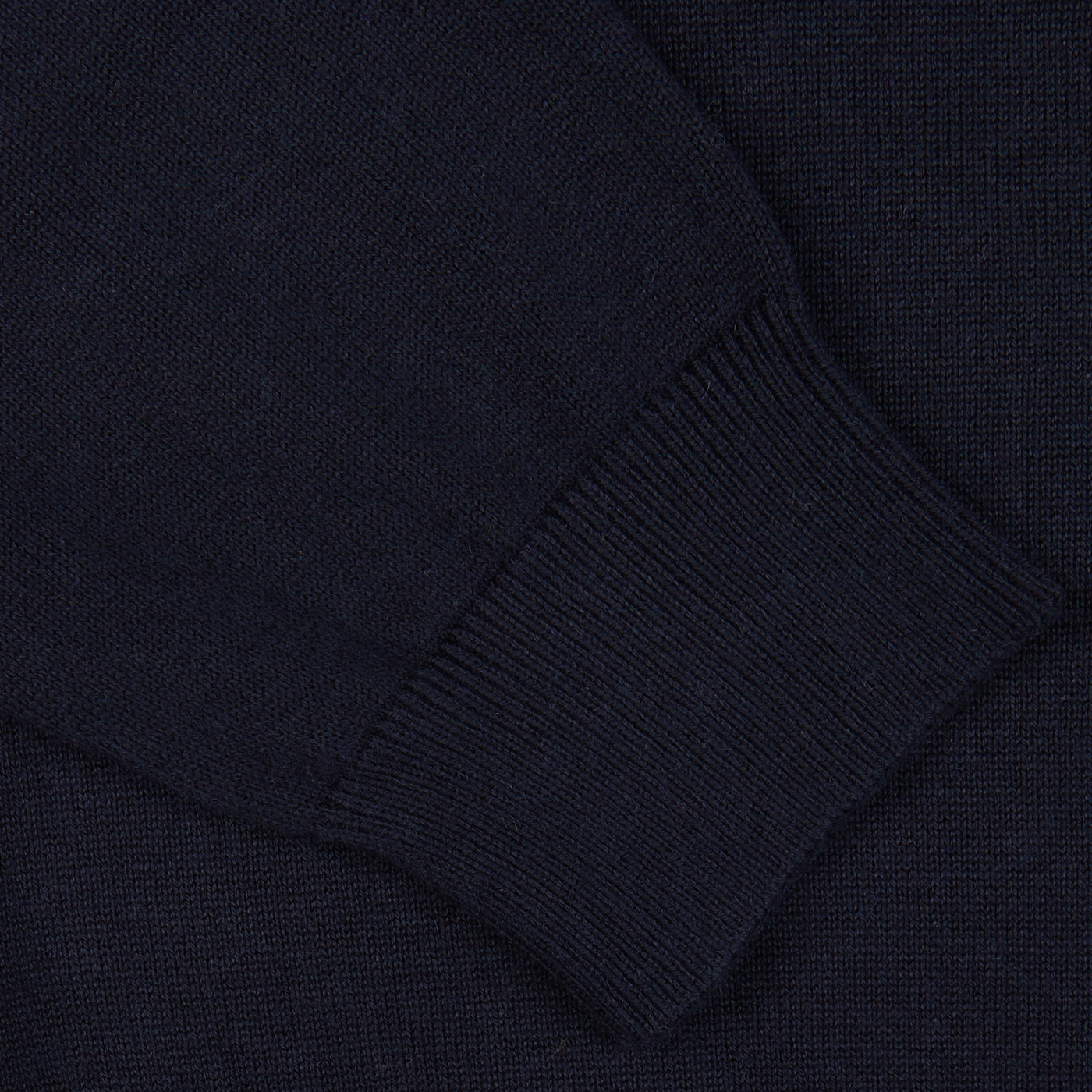 Close-up of Alan Paine's Navy Blue Luxury Cotton Crewneck with a ribbed cuff detail.