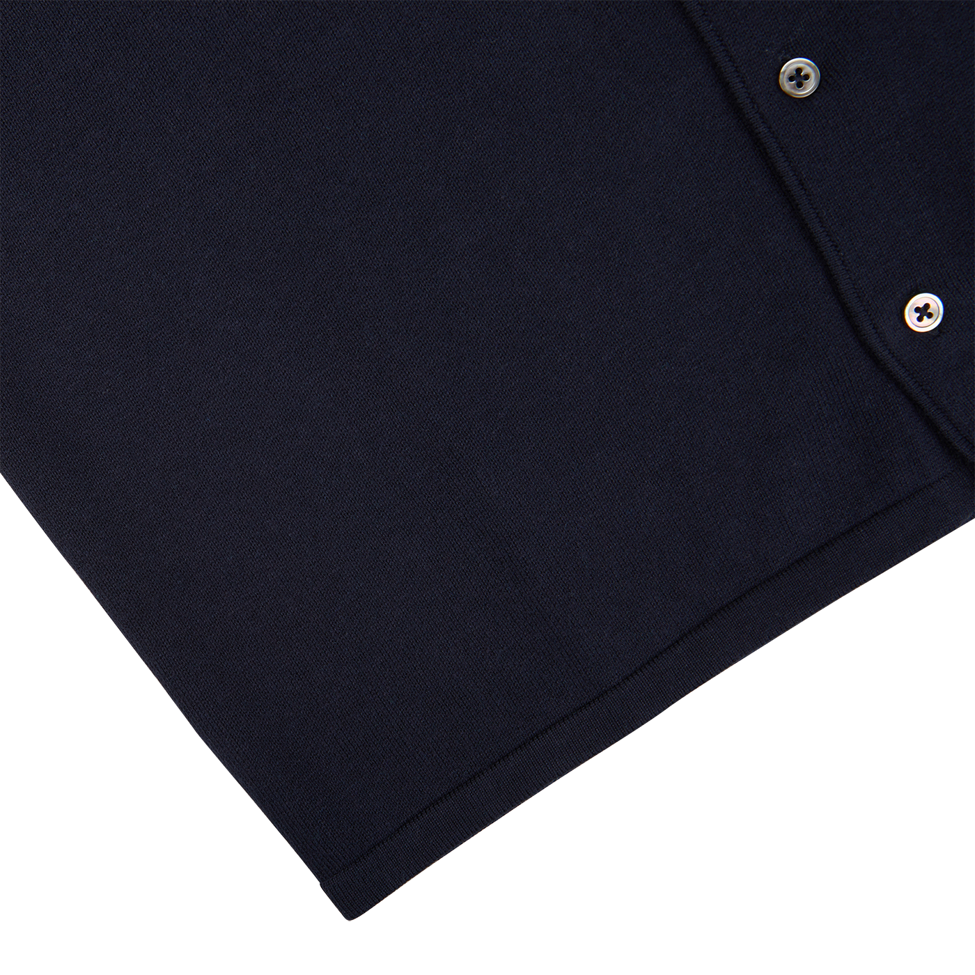A close up of an Alan Paine navy blue luxury cotton knitted overshirt with buttons.