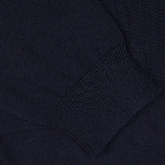 Close-up of an Alan Paine Navy Blue Luxury Cotton V-Neck Sweater with ribbed detailing.