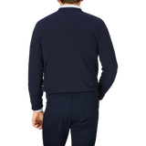 Man seen from behind, wearing a dark blue Alan Paine Navy Blue Luxury Cotton V-Neck Sweater and pants.