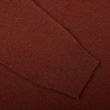 A close up of an Alan Paine Nebula Red Brown Lambswool V-Neck sweater made with Australian lambswool.