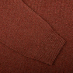 Close-up of a Nebula Red Brown Lambswool V-Neck sleeve by Alan Paine, showcasing the texture and ribbed cuff.