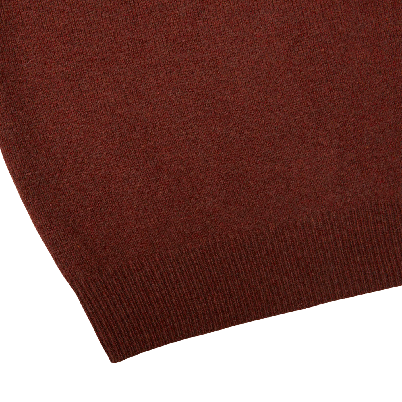 A close up of a Nebula Red Brown Lambswool V-Neck sweater by Alan Paine on a white surface, made with Australian lambswool.