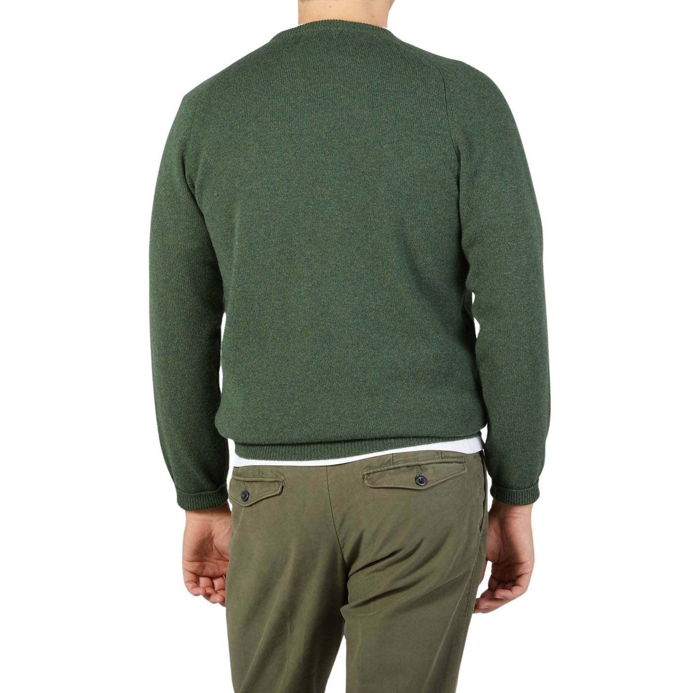 The contemporary version of a man wearing an Alan Paine Rosemary Green Lambswool crew neck sweater and khaki pants.