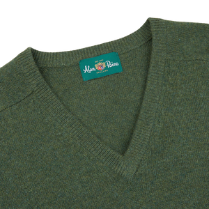 A contemporary Rosemary Green Lambswool V-Neck sweater with an Alan Paine label.