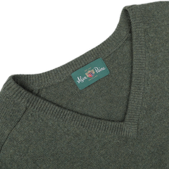 A detailed view of the Rosemary Green Lambswool V-Neck, featuring a contemporary fit and crafted from luxurious Australian lambswool, with a label reading "Alan Paine England.