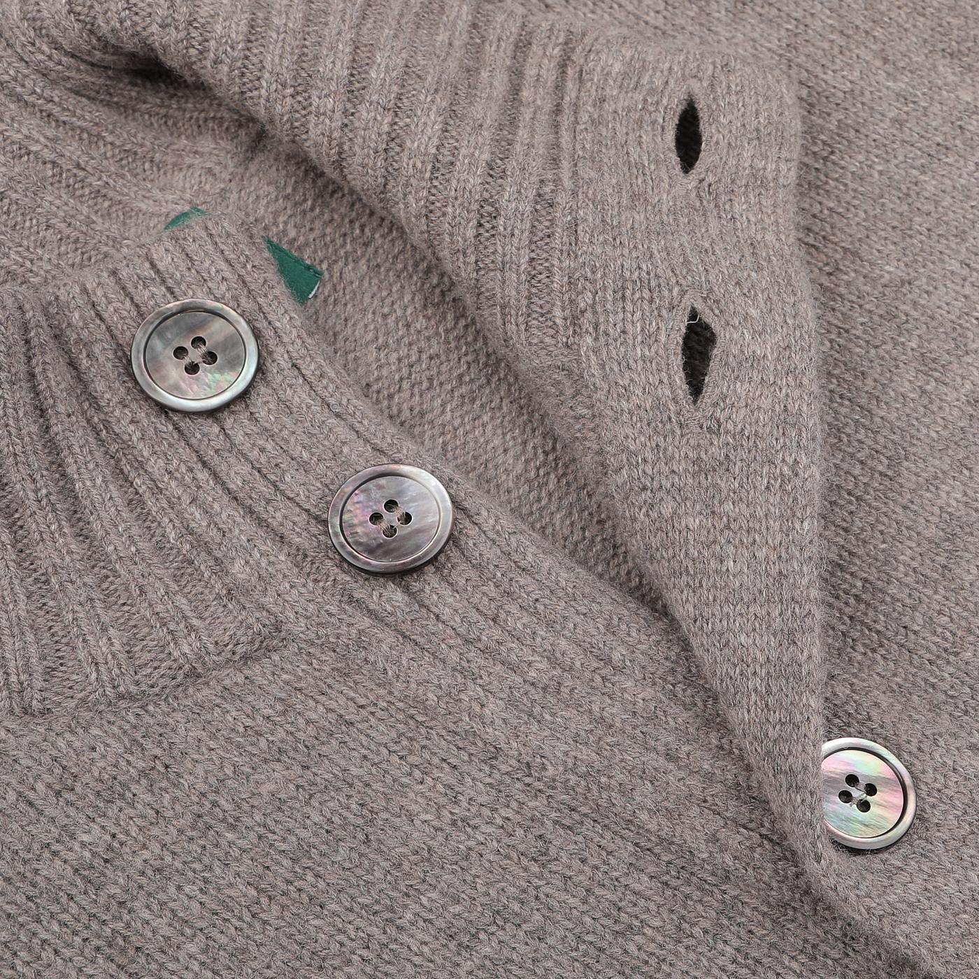 Close-up of the Taupe Beige Lambswool Landford Cardigan by Alan Paine, featuring a ribbed collar adorned with three iridescent buttons.