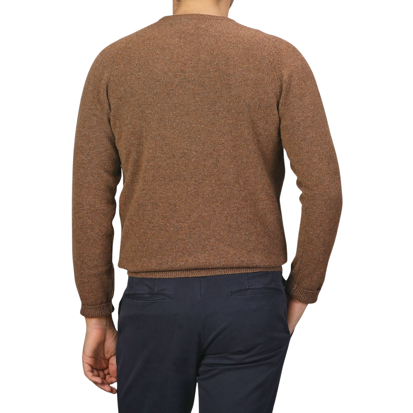 A person wearing an Alan Paine Tobacco Brown Lambswool Crew Neck with saddle shoulder detailing and navy blue pants is seen from the back against a plain white background.