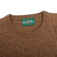 Introducing the Tobacco Brown Lambswool Crew Neck by Alan Paine— a luxurious Australian lambswool sweater featuring a green label on the inside that reads "Alan Paine England." The saddle shoulder design adds a touch of sophistication to this timeless piece.