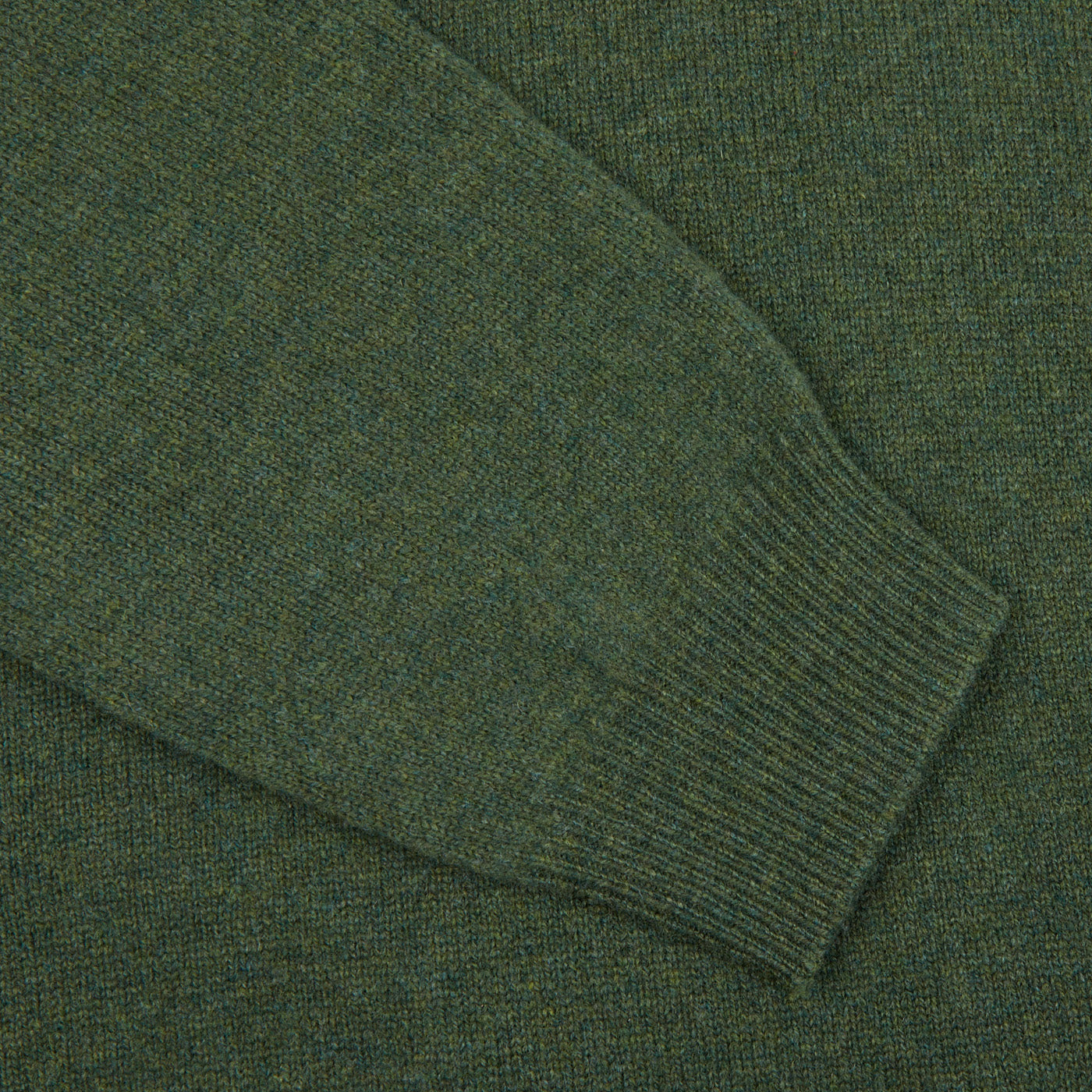 A contemporary version of an Alan Paine Rosemary Green Lambswool Crew Neck sweater, shown in a close-up shot.