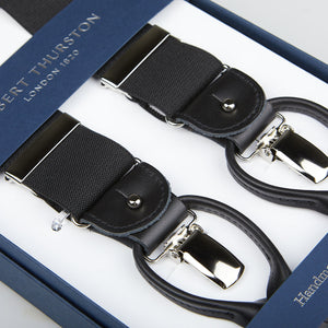 Black Albert Thurston handmade braces with leather details and silver clasps, displayed in a blue box with a logo.