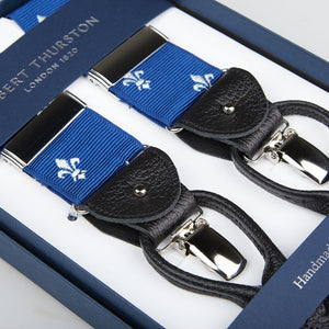 A pair of Blue with White French Lily 40 mm Braces with leather details, displayed in a box labeled "Albert Thurston.