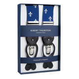 A pair of elegant Albert Thurston Blue with White French Lily 40 mm braces with classic blue straps and leather details, displayed in a box.