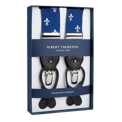 A pair of elegant Albert Thurston Blue with White French Lily 40 mm braces with classic blue straps and leather details, displayed in a box.