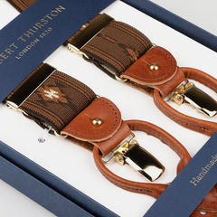 The Brown Western Pattern Nylon Elastic 35mm Braces by Albert Thurston are elegantly showcased in a display box marked "Albert Thurston, London 1820.