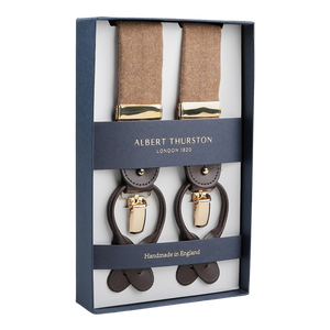 A boxed set of Albert Thurston's Camel Beige Wool Flannel 35 mm Braces, crafted with brown leather and gold clips and elegantly labeled "Handmade in England.