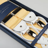 Yellow and white handmade Champagne Nylon Leather 40 mm braces with silver clasps, displayed in an open blue box, branded with "British brand Albert Thurston, London 1820.
