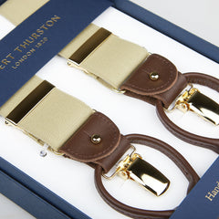 A pair of Albert Thurston Dark Beige Nylon Elastic 35mm Braces displayed in a blue box with gold lettering, featuring beige straps and brown leather details.