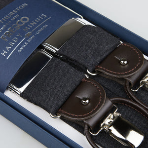 A pair of Grey Fresco Wool Leather 35 mm Braces with leather details, displayed in an open blue box labeled "Albert Thurston.