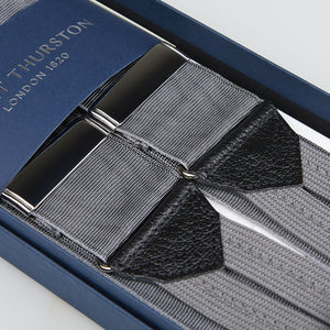 A pair of Albert Thurston Grey Moire 38 mm Braces with leather details, packaged in a blue branded box.