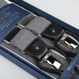 Grey Wool Fresco Leather 35 mm Braces with silver clips, presented in a blue gift box labeled "Handcrafted essentials" by Albert Thurston.
