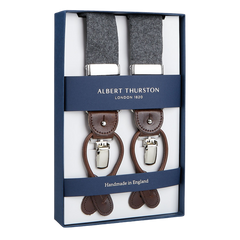 A pair of handmade Albert Thurston Light Grey Wool Flannel 35 mm Braces displayed in an open box.