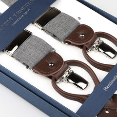 Albert Thurston's Light Grey Wool Fresco 35mm Braces feature brown leather details and silver clasps, all thoughtfully packed in a sleek blue box.