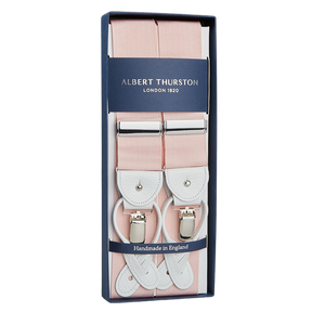 Light Pink Albert Thurston suspenders, crafted from stretchable nylon fabric, in a blue gift box labeled "Handmade in England.