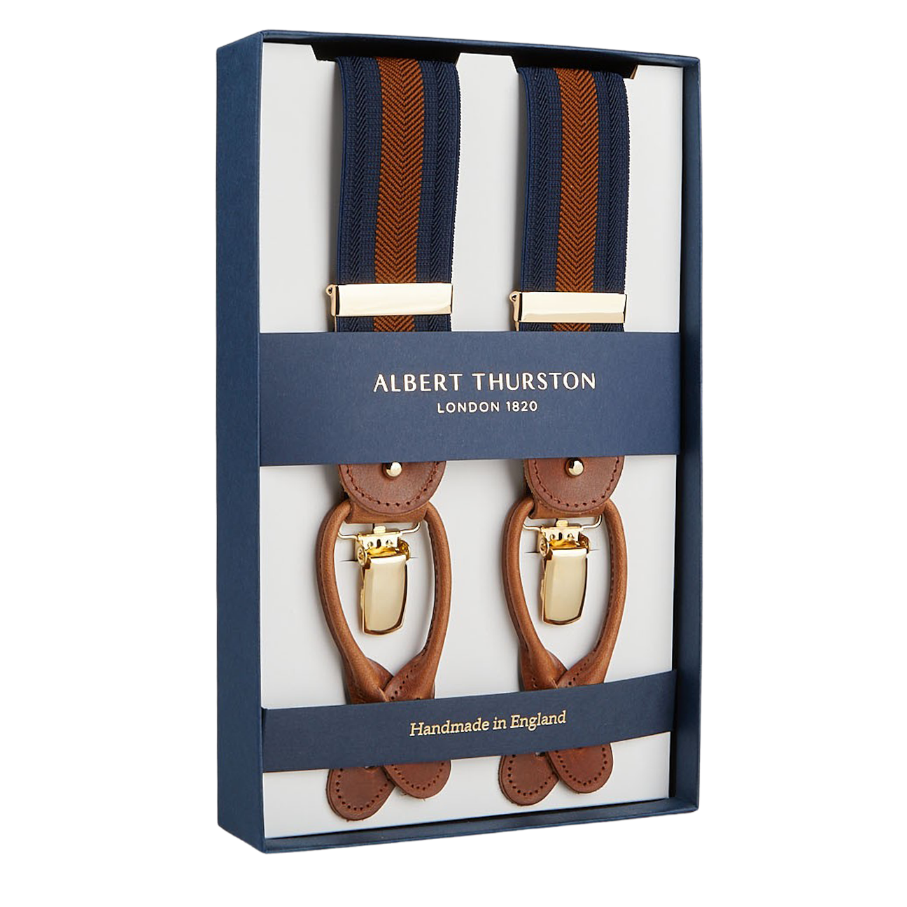 A boxed set of Albert Thurston Navy Brown Striped Nylon Leather 35 mm Braces with brown leather detailing and blue and brown fabric straps. The packaging, indicative of this esteemed British brand, proudly notes these suspenders are handmade in England.