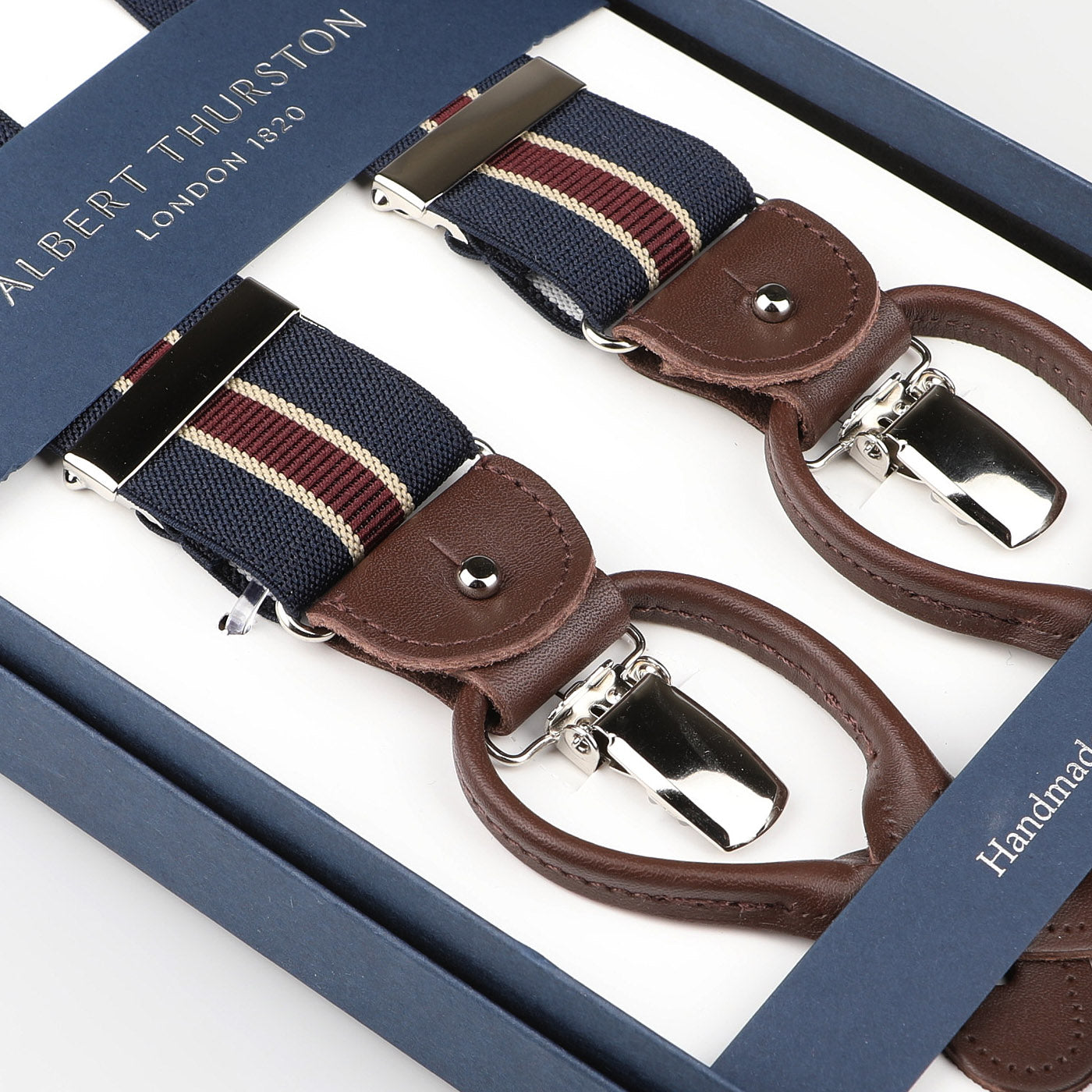 Albert Thurston Navy Burgundy Striped Nylon Elastic 35mm Braces with brown leather details and silver clips come in a boxed set.