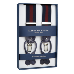 A pair of Albert Thurston Navy Burgundy Striped Nylon Leather 35 mm Braces, displayed in a box, indicating they are handmade in England.