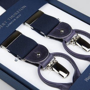 Navy elastic suspenders with silver clasps, displayed in an open box labeled "Albert Thurston London 1820.