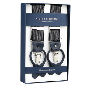 A set of Albert Thurston Navy Blue Herringbone Nylon Elastic 38mm Braces, featuring two handmade braces with leather loops and metal clips, labeled "Handmade in England.