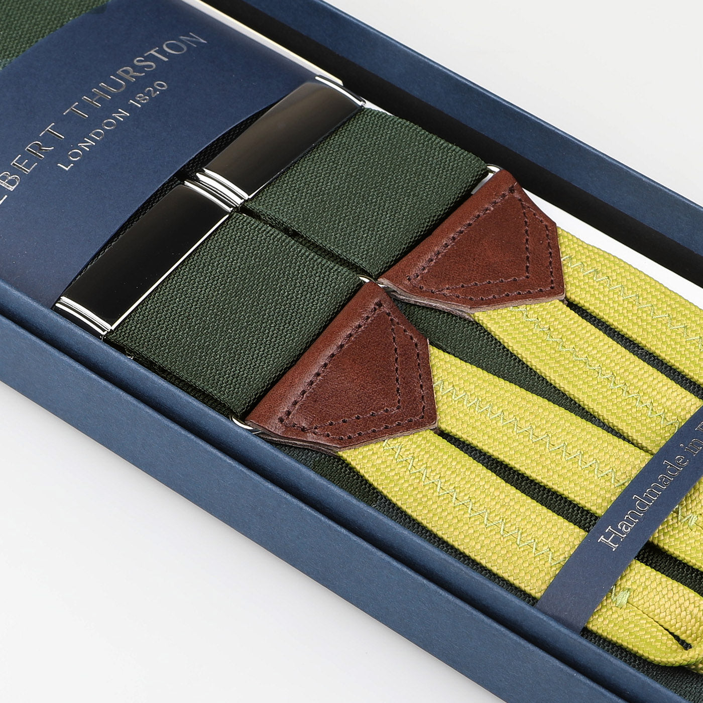 Box containing Albert Thurston Tartan Green Nylon Barathea 40mm Braces featuring green and yellow stripes with brown leather accents.