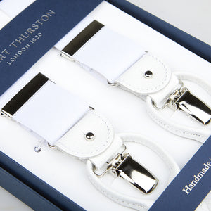 White Albert Thurston nylon elastic 35mm braces with silver clips and black accents displayed in an open blue box labeled "handmade" and "Albert Thurston, London 1850.