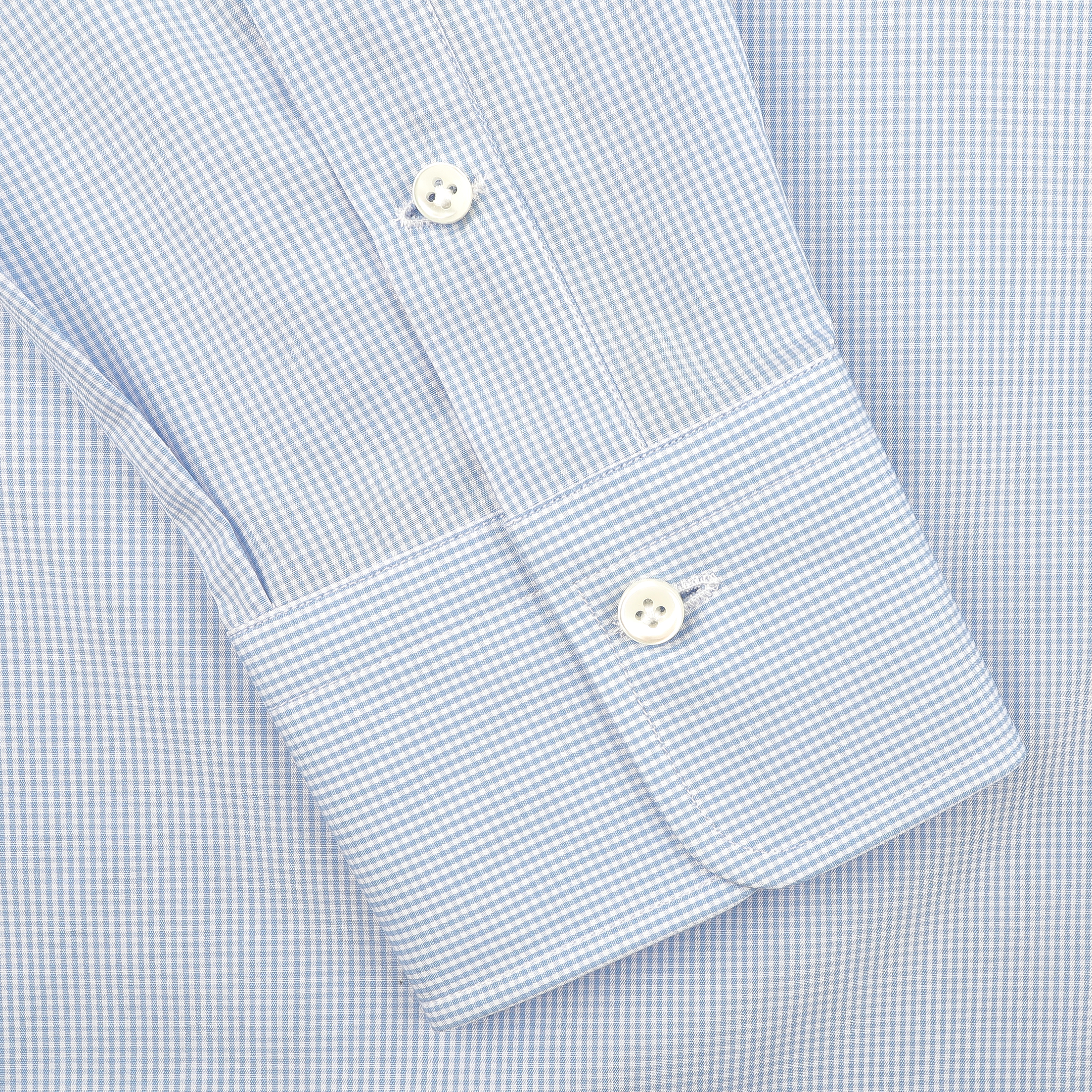 Close-up of Alessandro Gherardi's Blue Gingham Checked Cotton Single Cuff Shirt, showcasing its light blue and white pattern with two white buttons.